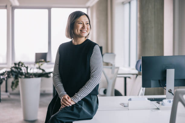 Smiling Chinese woman at the office