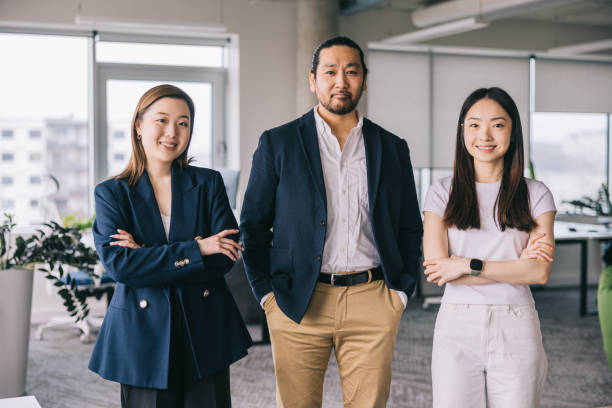 istock Japanese business colleagues pose for a portrait image 2150098778