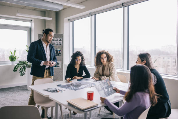 istock Diverse designers having a meeting together at the office 2150098822