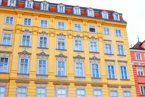 Architecture of old town of Vienna, Austria. Building with attics and ywllow wall