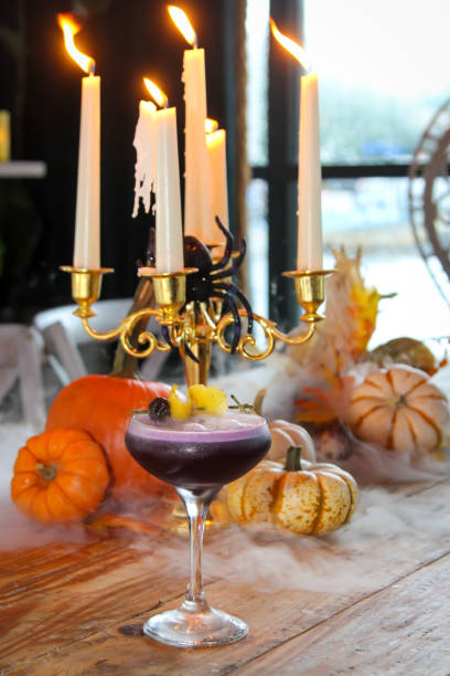 istock Halloween themed purple cocktail with smoke 2150100181