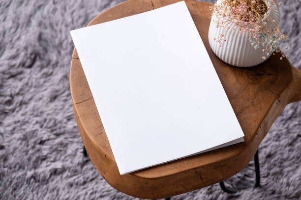istock blank magazine mockup on coffee table with vase and grey rug 2150100347