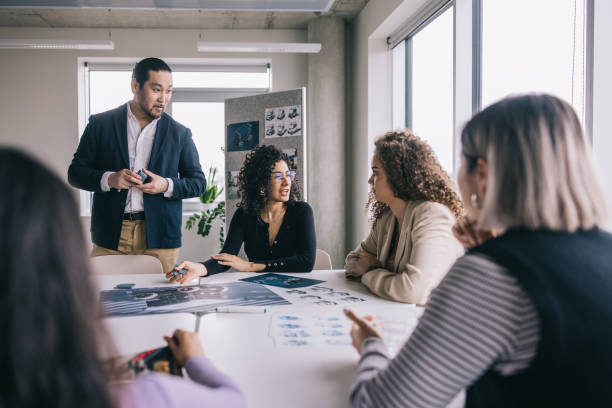 istock Diverse designers having a meeting together at the office 2150100491