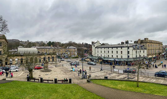 View across Buxton town centre, UK.  shops can be seen and people can be seen walking on the pavemants
