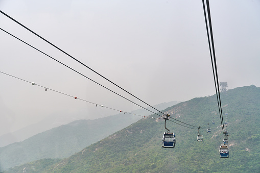 Hong Kong, China - April 15, 2023: Ngong Ping 360 cable car on a foggy day.