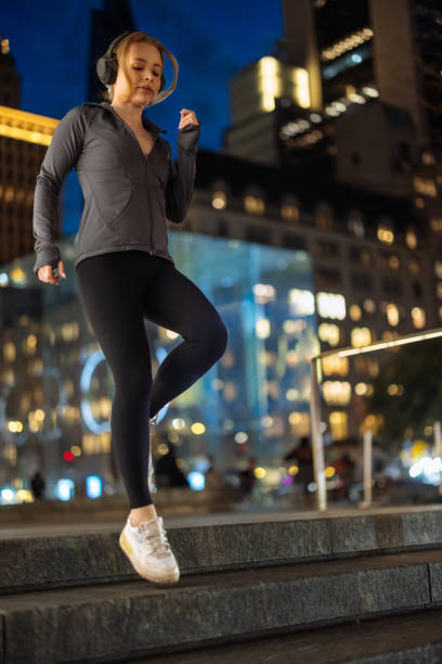 istock Evening jogging session in city lights 2150105324