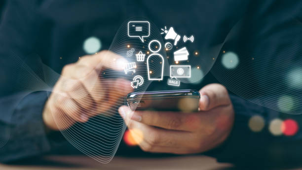 istock Digital Marketing Media Technology Graphic Concept, Business Lead And Customer Generation Magnet Pulling Figures, Businessman using mobile smart phone 2150109098