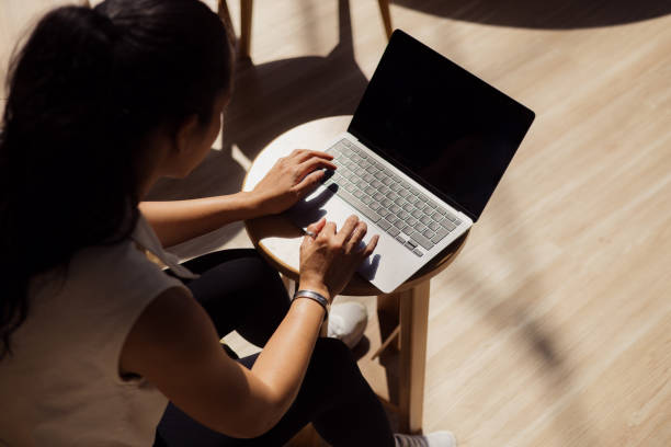 istock Above view of a woman working on a computer. 2150110906