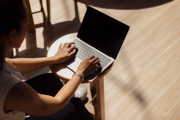 istock Close up of a woman working on a computer. 2150112265