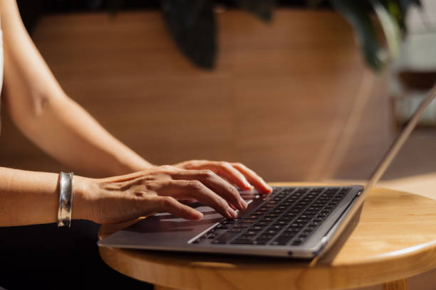 istock Close up of unrecognizable woman working on laptop. 2150112366
