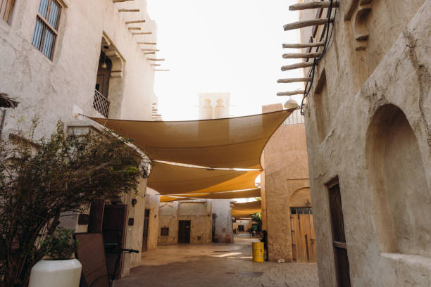 Old streets and authentic Persian buildings at Bastakiya district of Dubai city by the bay, United Arab Emirates