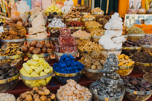 Tel Aviv, Israel - June 17, 2022:   A variety of turkish delight sweets, rolled in wildflower petals, almonds, and pistachios, on display at Carmel Market,(Shuk Hacarmel), Tel Aviv