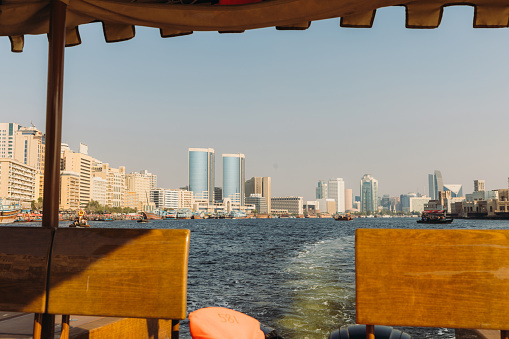 Point of view of riding the passenger boat from the ld town of Dubai city during sunny day