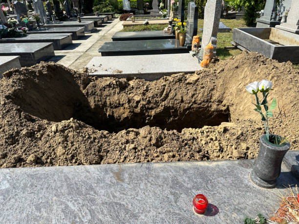istock Newly dug out grave site in the public cemtery 2150115018