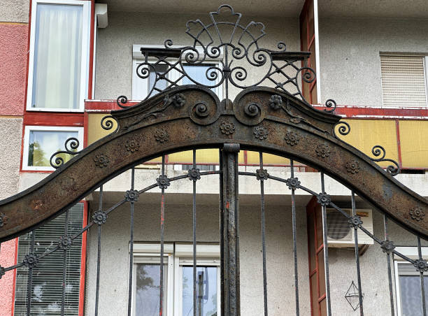 istock Wrougth iron ornate gate of a building 2150115144