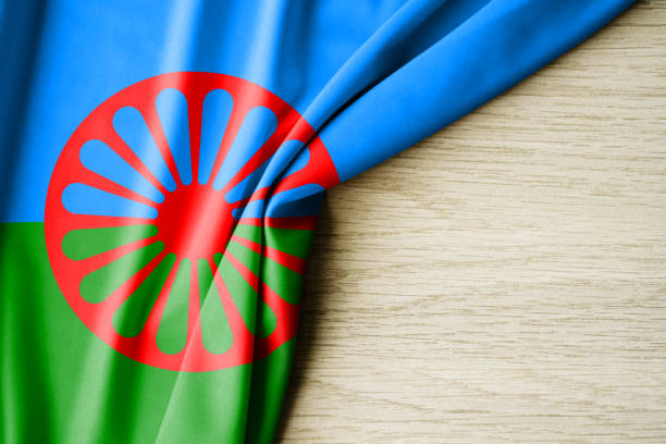 istock Romani people flag. Fabric pattern flag of Cuba. 3d illustration. with back space for text. Close-up view. 2150116014