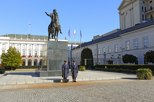 Warsaw, Poland - October 10, 2015: Guard of honour at the monument to Prince Jozef Poniatowski in front of the courtyard of the Palace, the official residence of the President of the Republic of Poland.