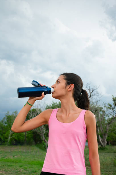 istock Young Athlete Replenishing After Training 2150119060