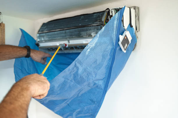 istock The technician are cleaning the air conditioner by spraying water 2150119943