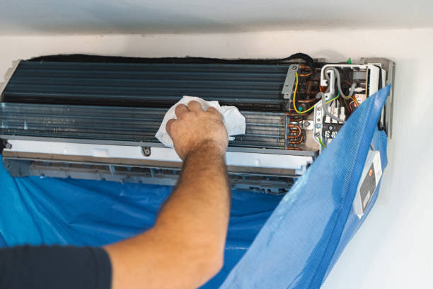 istock The technician are cleaning the air conditioner by spraying water 2150119959