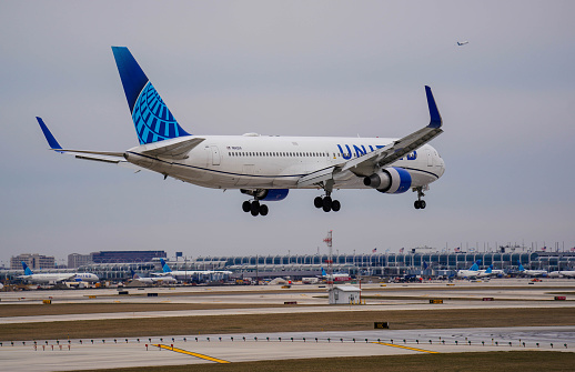 Chicago, IL, USA. United Airlines Boeing 767 prepares for landing at Chicago O'Hare International Airport.