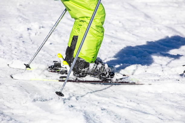 istock junior skier goes down the slope on a sunny day. Active recreation. School holidays 2150120780