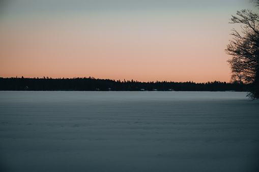 During winter in Sweden the sunset is early. This photo is taken around 3pm and the sun is already under the horizon. It's very cold but the contrast from the sun and the cold climate makes the color pop in a very beautiful way.