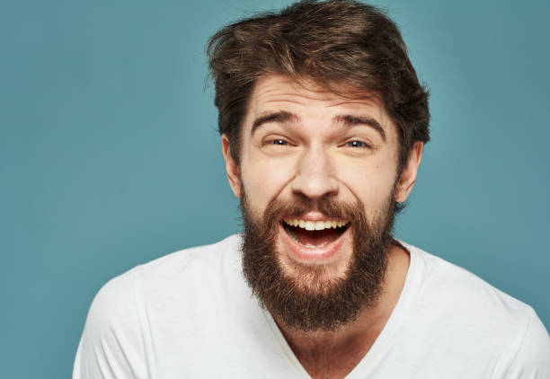 istock Happy man joy delight emotions blue background thick beard 2150122474