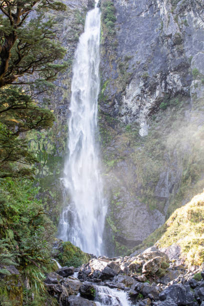 istock Devils Punchbowl waterfall cascades amid lush NZ greenery, a jewel of Arthur's Pass 2150122672