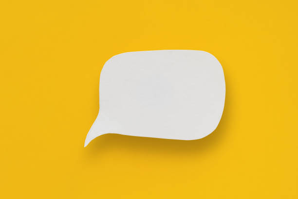 istock Conceptual image about communication and social media, customer feedback, real blank white speech bubble paper cut on grunge yellow color background 2150127396