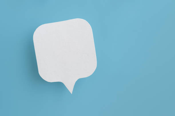 istock Conceptual image about communication and social media, customer feedback, real blank white speech bubble paper cut on grunge blue color background 2150127414