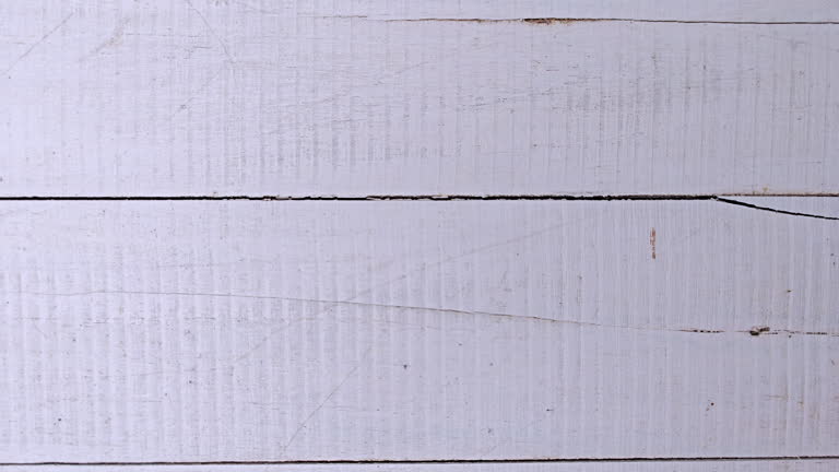Old weathered white painted  grunge teak wood plank background.