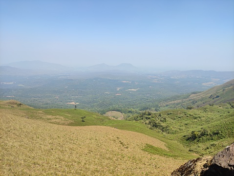 Panoramic view capturing mountainous terrain from a lofty, elevated perspective.