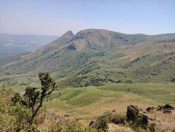 istock Mountain landscape with green hills and blue sky. 2150131432