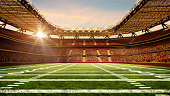 american-football-stadion-mit-gelbem-torpfosten-rasenplatz-und-verschwommenen-fans-auf-der.jpg?b=1&s=170x170&k=20&c=uKK1BqVA0W0VR1bw6pGYiOCfMABRSLhN9Jm8Nz-xMs8=