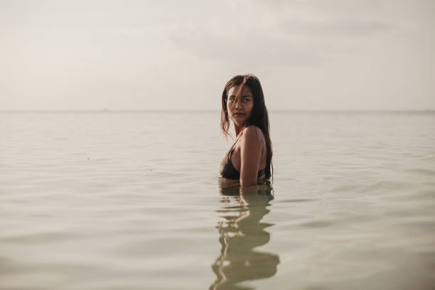 istock Woman enjoying in the sea 2150132296