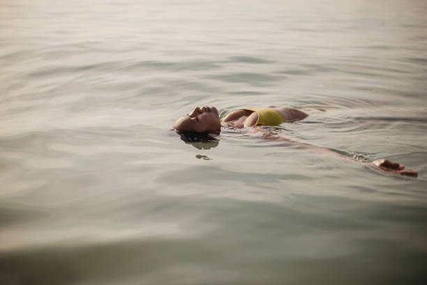 istock Woman enjoying in the sea 2150132301