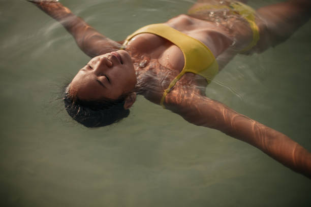 istock Woman enjoying in the sea 2150132363