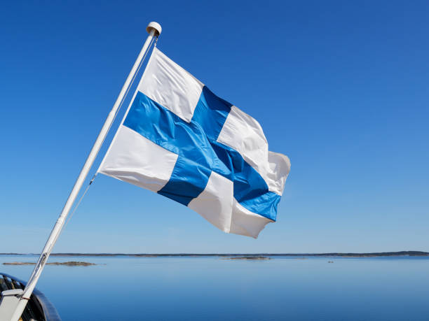 istock Finnish flag, archipelago panorama, sea, islands, blue sky. 2150132785