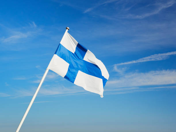 istock Finnish flag on the flagpole against the blue sky. 2150132875