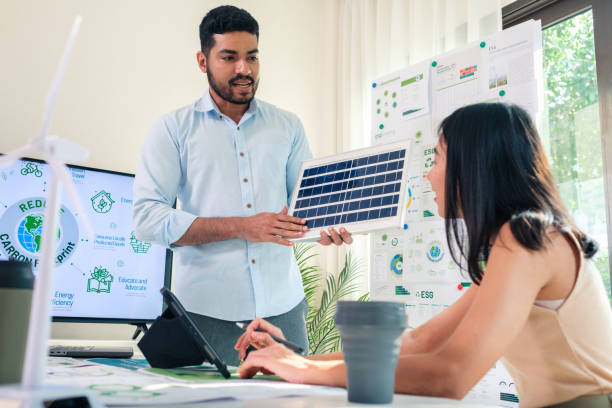 istock Diversity team presentation new design solar cell panel renewable energy innovation at office 2150134133