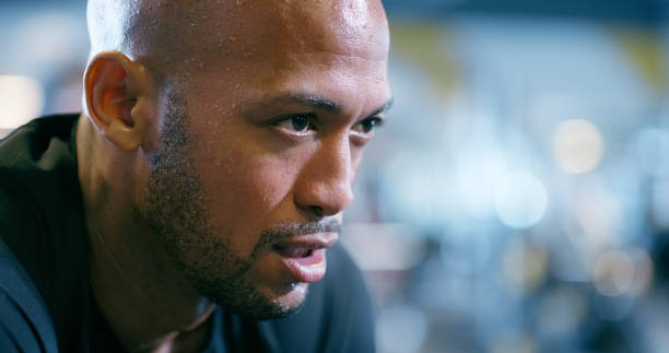 istock Workout, sweat and face of man in gym with confidence, hard work or commitment to exercise. Fitness, challenge and athlete thinking with inspiration, wellness and pride with mockup at sports club 2150134159