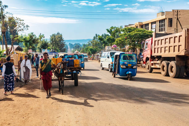 Ordinary peoples on the street of Dembecha Ethiopia DEMEBECHA, ETHIOPIA, APRIL 20.2019. People walking on the Ethiopian street in the morning. Demebecha, Amhara Region Ethiopia, April 20. 2019 ethiopia city stock pictures, royalty-free photos & images