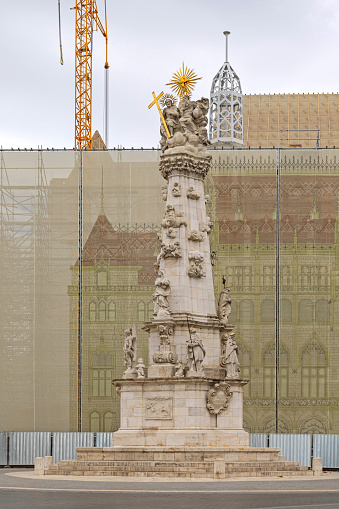 Budapest, Hungary - July 31, 2022: Holy Trinity Statue Historic Landmark and Renovation Works Scaffoldings at Buda Castle District.