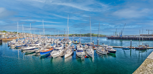 Numerous boats crowd Falmouth Marina under clear blue skies at Falmouth, England, United Kingdom