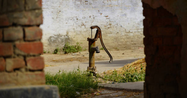 photograph of an old hand pump