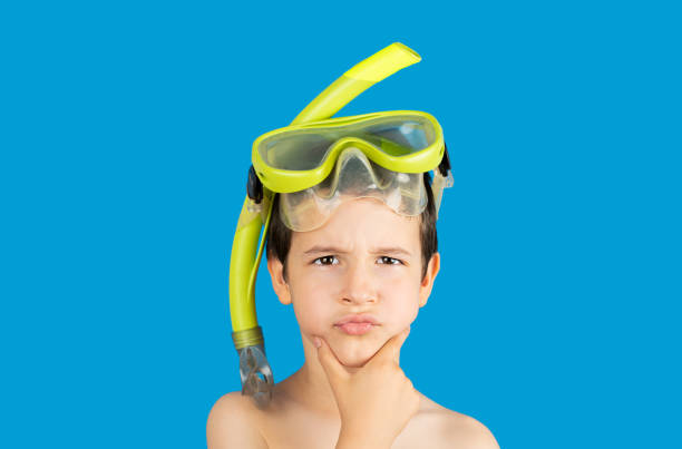 istock Pensive kid with snorkel mask tub 2150140127