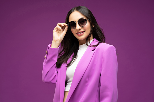 Portrait of her she nice well-dressed attractive lovely luxury pretty cheerful girl isolated purple background