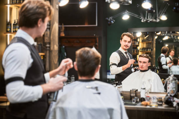istock Professional barber showing result to client. 2150140961