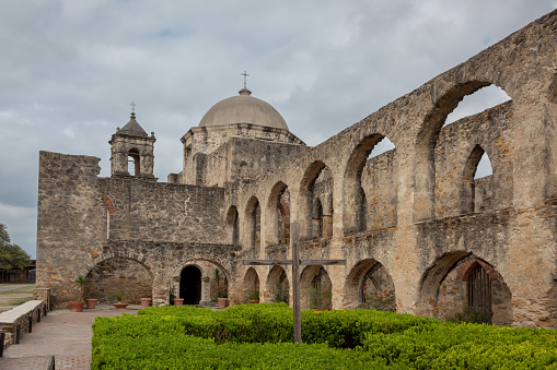 Architecture and exterior of an old San Antonio Texas mission San Jose on a cloudy day